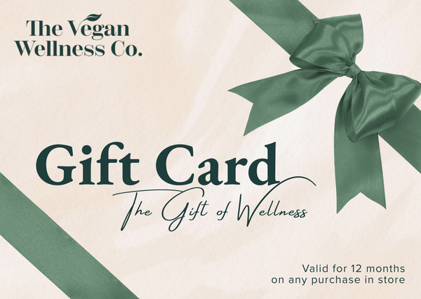 Gift card from The Vegan Wellness Co. with a green ribbon on a beige background