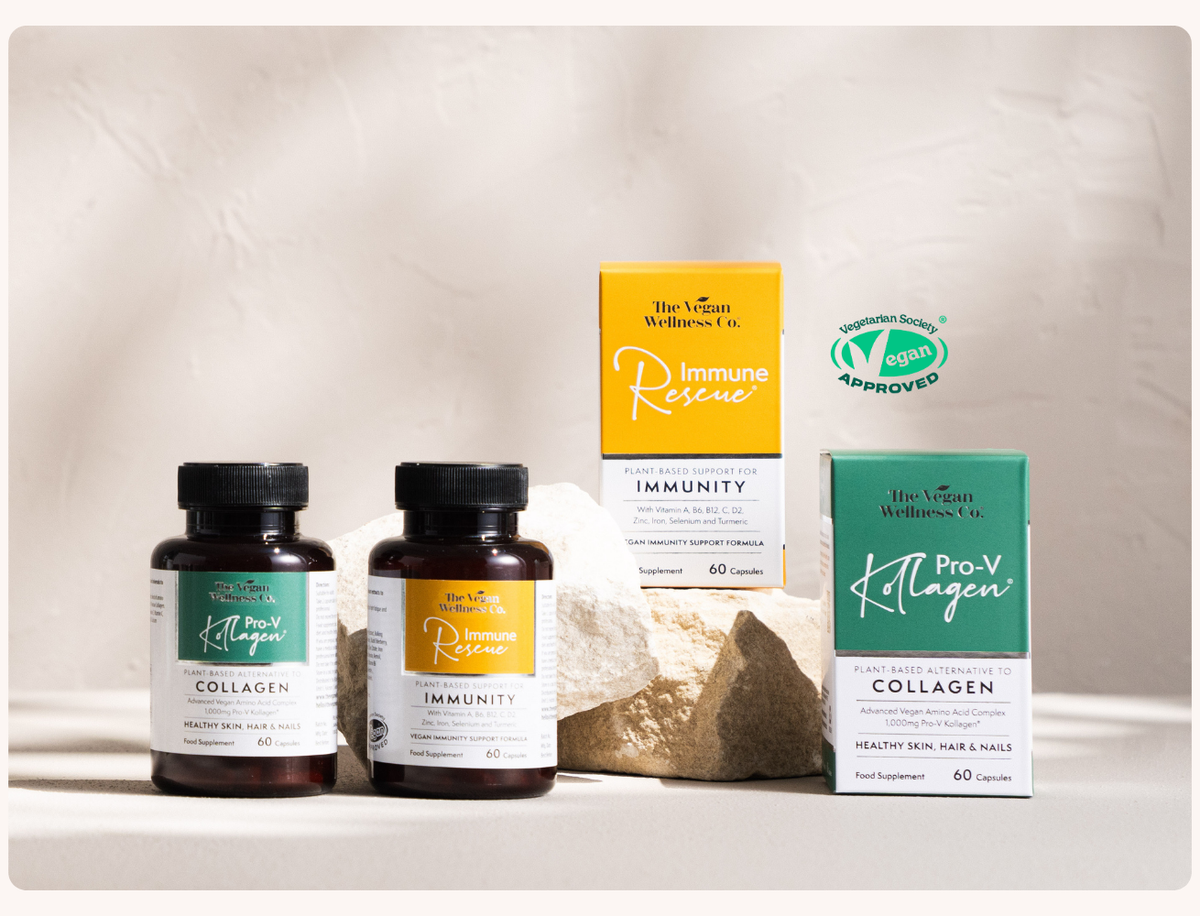 Two supplement bottles and two boxes on a neutral background