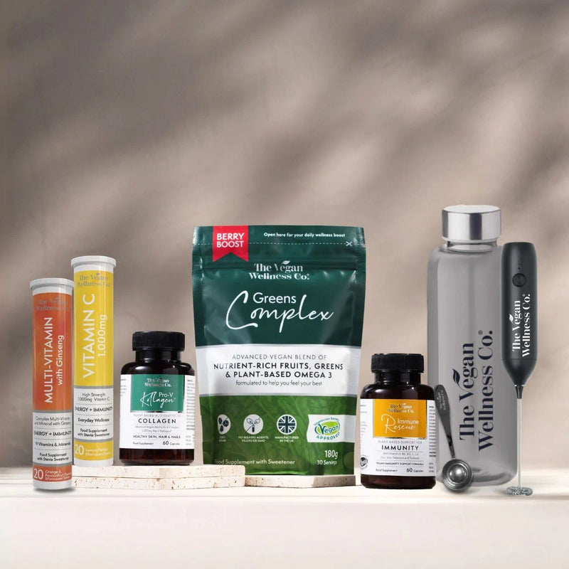 Collection of health and wellness products from The Vegan Wellness Co. on a neutral background